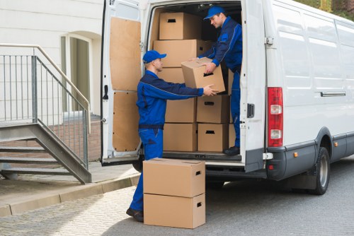 Man with van loading household items in Cowley