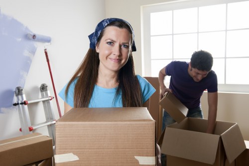 Local removals crew loading boxes for a home move in Cowley