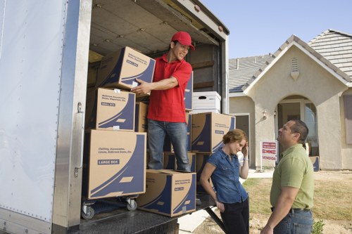 Loading furniture and boxes into a van for a Cowley removal