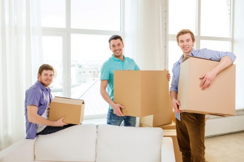 Moving boxes and furniture in a Cowley residential street
