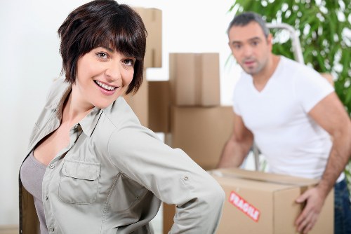Trained movers handling furniture with caution in Cowley