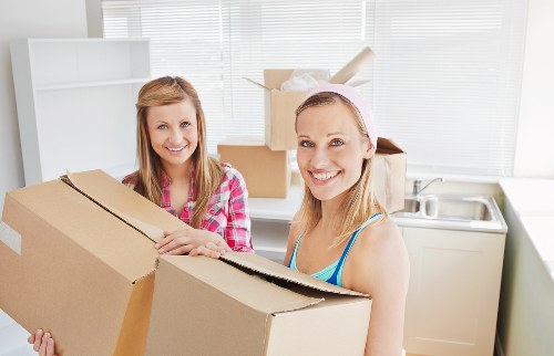Furniture and boxes being loaded into a removals van